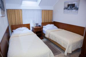 Postel nebo postele na pokoji v ubytování Hotel Baden