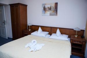 Postel nebo postele na pokoji v ubytování Hotel Baden