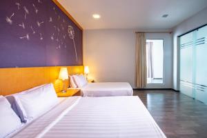 Letto o letti in una camera di Nova Highlands Hotel