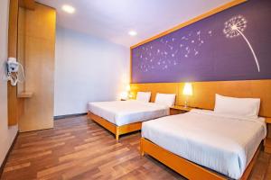 Letto o letti in una camera di Nova Highlands Hotel