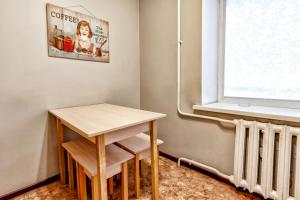 a small table in a room with a window at 425 Апартаменты в Золотом квадрате в центре Отлично подходят для командированных и туристов in Almaty