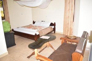 Postel nebo postele na pokoji v ubytování Rainbow Executive Lodge