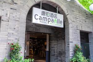 a building with a sign that reads campanic motel transmitter at Campanile Shanghai Huaihai in Shanghai