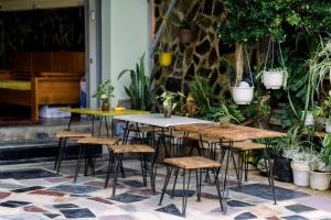 a group of tables and chairs on a patio at Nụ Cười Xinh in Da Lat