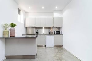 Kuchyň nebo kuchyňský kout v ubytování Design flat in Campolide