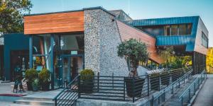a building with a tree in front of it at Hotel Termalny in Uniejow +37 photos