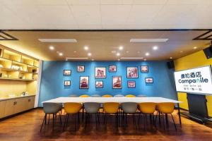 a conference room with a large table and chairs at Campanile Shanghai Huaihai in Shanghai