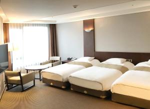 Postel nebo postele na pokoji v ubytování Mstay Hotel