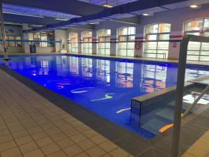 a large swimming pool in a building at Castlefield Hotel in Manchester