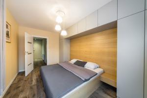 Posteľ alebo postele v izbe v ubytovaní Apartament Rakowicka 14 Deluxe Old Town WAWELOFTS