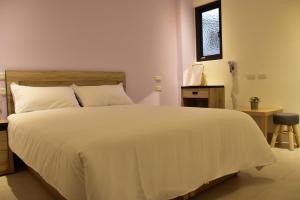 Postelja oz. postelje v sobi nastanitve Haichin&Haiting B&B