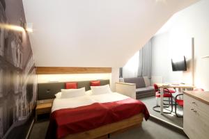 Posteľ alebo postele v izbe v ubytovaní Hotel Strážnice