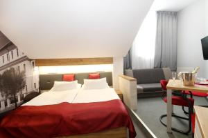 Posteľ alebo postele v izbe v ubytovaní Hotel Strážnice