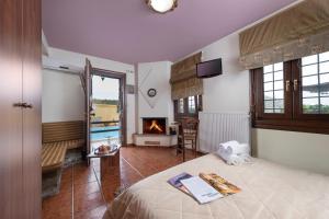 Postel nebo postele na pokoji v ubytování Hotel Petradi + 37 fotografií