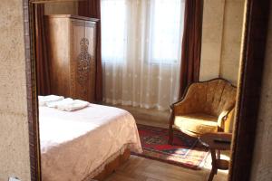 A bed or beds in a room at Emre's Stone House