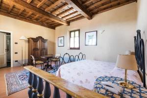 En eller flere senge i et værelse på I Casali del Trebbiolo