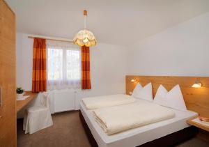 Postel nebo postele na pokoji v ubytování Hotel Garni Paler + 25 fotografií