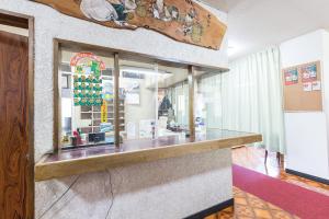 a counter in a restaurant with a christmas tree at Tabist Samotokan Owariasahi in Owariasahi