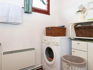 a laundry room with a washing machine and a window at 6 person holiday home in Hemmet in Hemmet