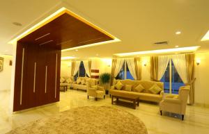 a living room with couches and a couch and chairs at Le Paris Residency Sabah Al Salem in Kuwait