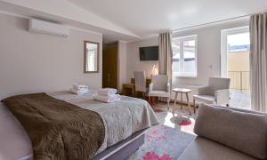 a bedroom with a bed and a table and chairs at Hotel Prague Star in Prague