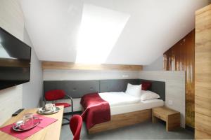 Posteľ alebo postele v izbe v ubytovaní Hotel Strážnice