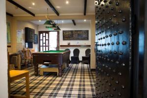 a room with a pool table and a ping pong ball at Gilpin Bridge Inn in Kendal