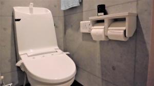 a bathroom with a white toilet in a room at lineweb Home sapporo in Sapporo +22 photos