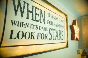 a sign that says when it rains when its dark look for stars at Sea 'n' Stars Platinum Plus Holiday home with Views, Free Wifi and Netflix in Camber