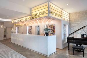 a store with a grand piano and a grand piano at Le 123 S&eacute;bastopol - Astotel in Paris