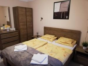 Posteľ alebo postele v izbe v ubytovaní Tulip Family Apartments