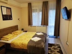 Posteľ alebo postele v izbe v ubytovaní Tulip Family Apartments