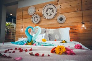 Tempat tidur dalam kamar di Hotel Chalets Chamarel