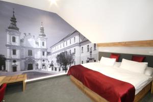 Posteľ alebo postele v izbe v ubytovaní Hotel Strážnice
