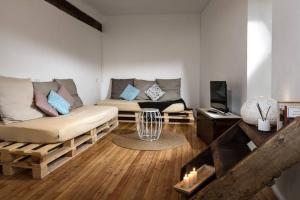 a living room with a couch and a table at Al vicolo del Gallo APPARTAMENTO in Varallo