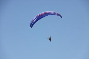 a paraglider flying in the sky at Lamedina Hotel & Resort in Jounieh