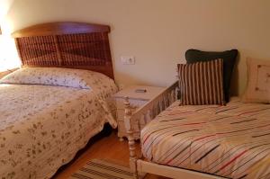 Postel nebo postele na pokoji v ubytování Vivienda Vacacional Casa Abuela Herminia + 10 fotografií