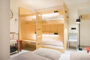 a room with two bunk beds in it at The Green Elephant Hostel & Spa in Maastricht