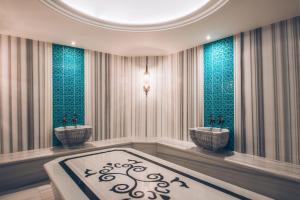 a rendering of a bathroom with two sinks and a rug at Iberostar Waves Slavija in Budva +37 photos