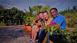 a group of people sitting next to a plant at Miheen Hotel & Resort - Anuradhapura in Mihintale