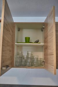 A kitchen or kitchenette at Glemm Lodge Apartments - JOKER CARD im Sommer inklusive