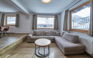 A seating area at Glemm Lodge Apartments - JOKER CARD im Sommer inklusive