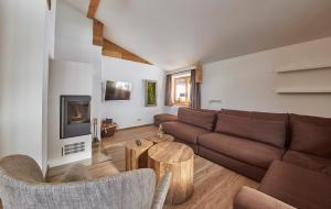 A seating area at Glemm Lodge Apartments - JOKER CARD im Sommer inklusive