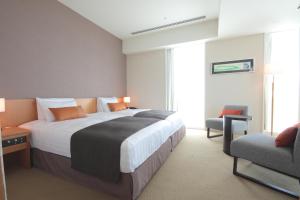 Postel nebo postele na pokoji v ubytování Hotel Arc Riche Toyohashi