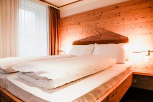 Letto o letti in una camera di Gasthaus zur Waldegg