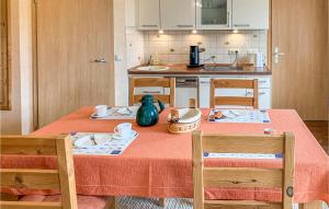 a kitchen with a table with two chairs and a table sidx sidx sidx at Pet Friendly Apartment in Gollwitz