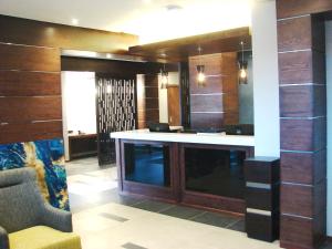 a large room with a bar in the middle at Premier Splendid Inn Bloemfontein in Bloemfontein