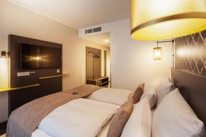 Holiday Inn - the niu, Mesh Stuttgart Messe by IHG房間的床