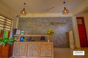 a counter in a room with two pendant lights at Rivora Residence in Kandy