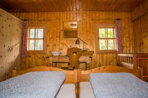 Postel nebo postele na pokoji v ubytování Tradlhof